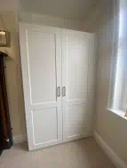 Lidded wardrobe fitted into an alcove to match an exsisting wardrobes already fitted at the opposite side (doors closed), fitted in Darlington